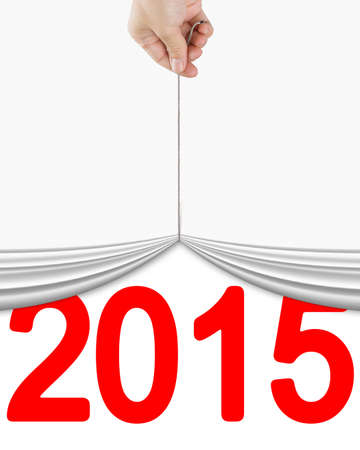 human hand pulling up curtain with bright red 2015 isolated on white background