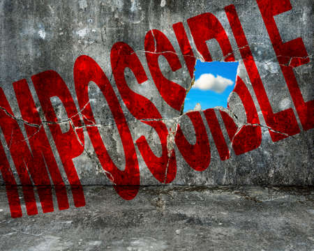 red impossible word with nature cloud sky through large hole on old mottled concrete wallの写真素材