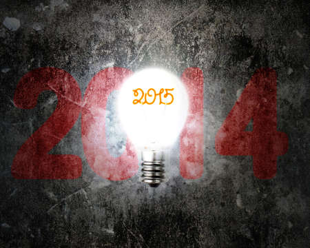 brightly 2015 light bulb illuminated dark 2014 old concrete wallの写真素材