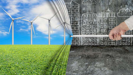 hand pulling open wind turbines curtain covering gray cityscape doodles concrete wall backgroundの写真素材