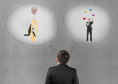 Business man imagining work situation with concrete wall backgroundの写真素材