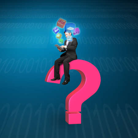 Businessman using tablet sitting on pink question mark with app icons and tech backgroundの写真素材