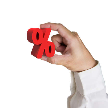 Hand holding 3D red percentage sign isolated on white background