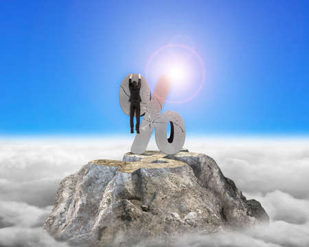 Businessman hanging on cracked percentage sign with dollar mountain peak sunlight cloudscape...