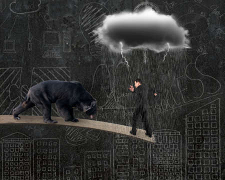 Businessman against black bear balancing on plank with gray cloud raining lightning and doodles wall...