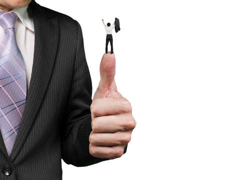 Man cheering on top of another big thumb against white backgroundの写真素材