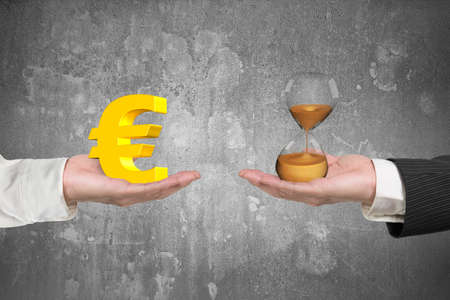 Euro symbol on one hand and hour glass on another hand, with gray concrete wall background, concept...
