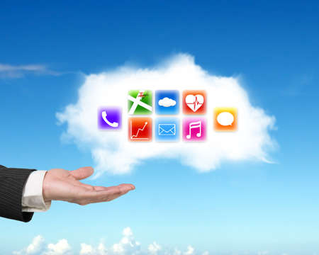 Male hand showing white cloud with colorful app icons on sky background