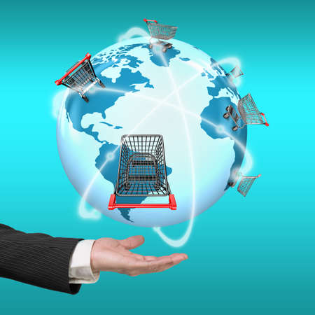 Hand showing 3D globe with world map of shopping carts worldwide, global shopping concept.