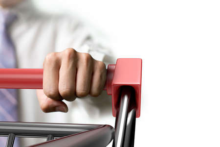 Man pushing shopping cart close-up, front view, isolated on white.の写真素材