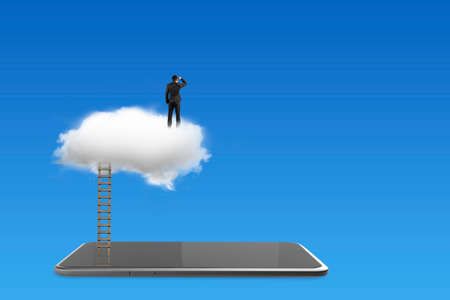 Smart tablet with businessman standing on white cloud, on blue background.の写真素材