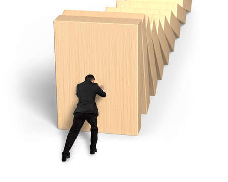 Man pushing and stopping dominoes falling, high angle view, isolated on white background.の写真素材