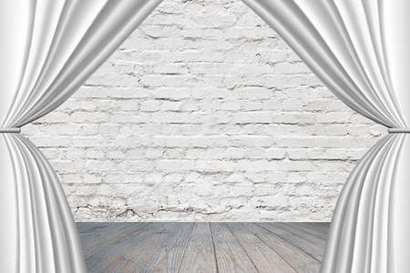 Stage with white curtains, on old brick wall background.の写真素材