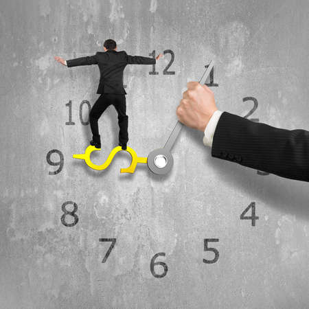 Man balancing on USD sign clock hand with another holding, concrete wall background, 3D illustrationの写真素材