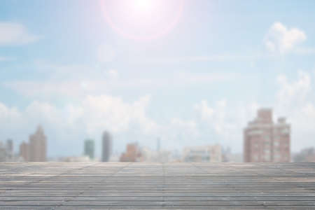 Old wooden floor in day with sunlight and city view background, nobody empty