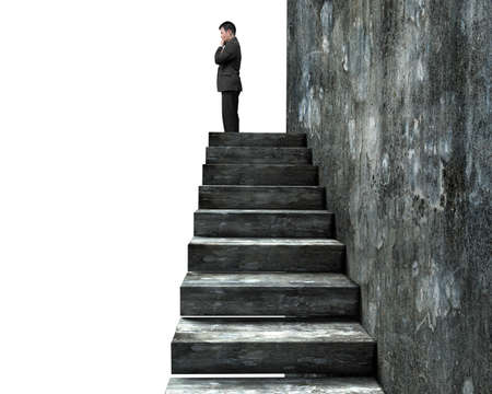Side view of man standing on top of concrete stairs, isolated on white background.の写真素材