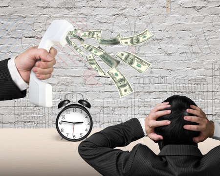 Hand holding white telephone handset with money spraying out to another man, on alarm clock and...