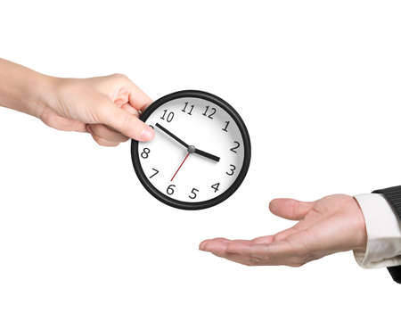 Woman's hand giving a clock to man's hand, isolated on white. Time is money concept.