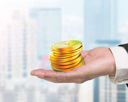 Hand holding stack of golden digital coin with question mark, concept of cryptocurrency, blockchain technology, bitcoin mining.の写真素材