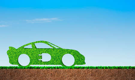 Green grass in car shape, on blue sky and soil cross section background, concept of ECO, renewable energy and circular economyの写真素材