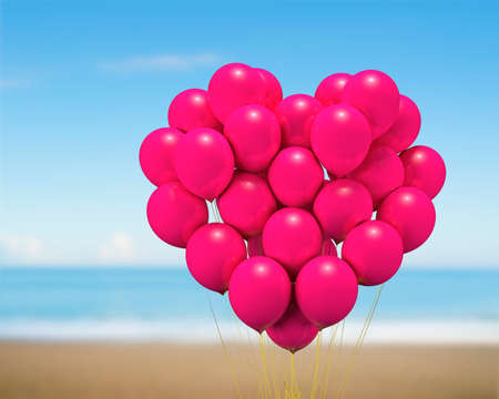 Bunch of bright red balloons arranged in heart shape floating, gift for love, on blue sky sea sandy beach background.の写真素材