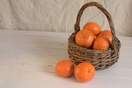 tangerines in basket on right, room for textの写真素材