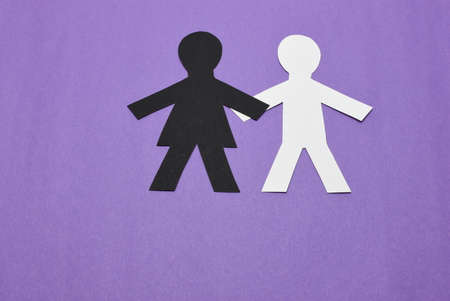 black female, white male silhouettes on purple backgroundの写真素材