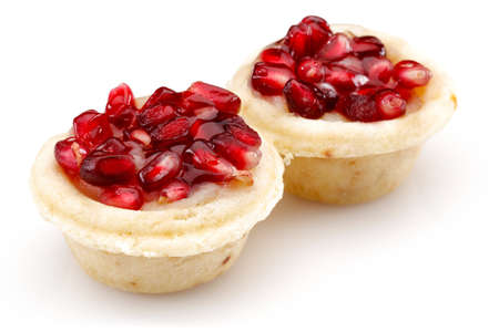 Pomegranate cupcake on isolated white backgroundの写真素材