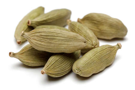 Cardamom seeds on a white background.の写真素材