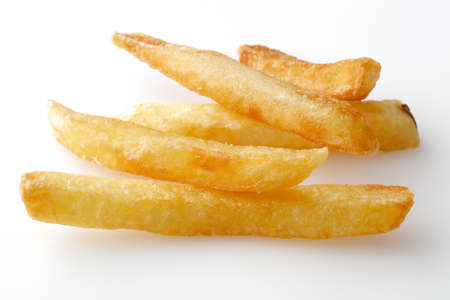 A pile of appetizing french fries on a white background.