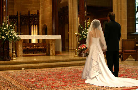 Bride and Groom at Altar (Closeup)の写真素材