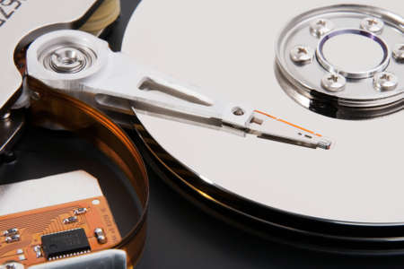 Macro photo from computer hard drive head and plate