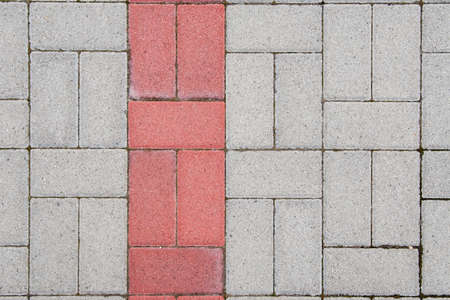 Concrete bricks with symmetrical pattern and red lineの写真素材