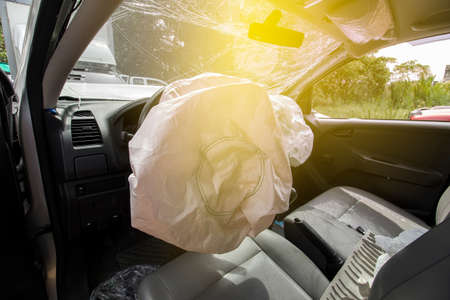 Car of accident make front windshield cracked and airbag explosion damaged at claim the insurance company. Working car repair  inspection at damaged of accident.   image blur focus  style.の写真素材