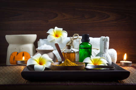 Thai Spa Set for body massage and skin care consists of salt, ground tumeric, clay honey, and essential oilの写真素材