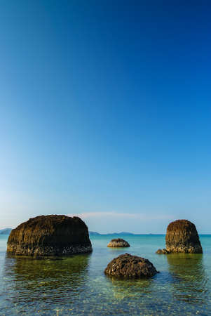 Volcanic rocks in the sea located at Kham Island in Thailandの写真素材