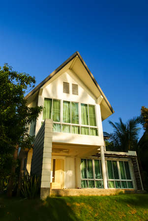 Beach house on the hill stands against beautiful sunset at Koh Mak (Mak island) Trad Province, Thailandの写真素材