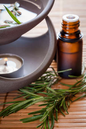 Essential oil with rosemary and oil burnerの写真素材
