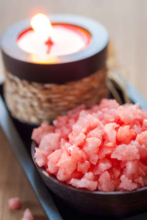 Pink spa salts and aromatic candle and dried flowersの写真素材