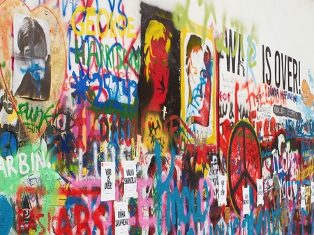 PRAGUE - DECEMBER 9, 2014:New paintings and inscriptions on the famous Lennon Wall in Prague on Kampa Island. Controversial art group from Prague recently repainted the wall completely on white and placed on the wall only inscription Wall is over.のeditorial素材