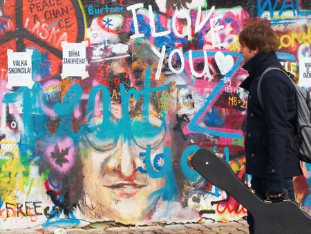 PRAGUE - DECEMBER 9, 2014: New paintings and inscriptions on the famous Lennon Wall in Prague on Kampa Island. Controversial art group from Prague recently repainted the wall completely on white and placed on the wall inscription Wall is over.のeditorial素材