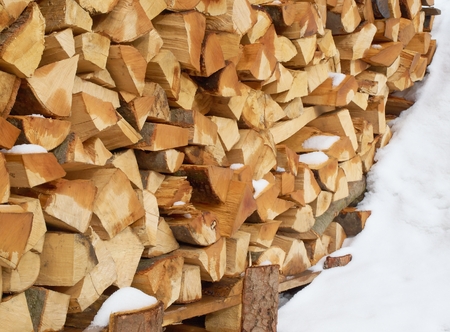 Pile of chopped fire wood from pineの写真素材