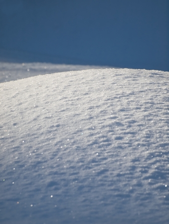 Partially lit place in the snowの写真素材