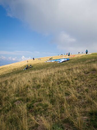 MALCESINE, ITALY â AUGUST 27  2019: Tandem paragliding on Monte Baldo above Lake Garda in the Garda Mountains in the Eastern Alps.のeditorial素材