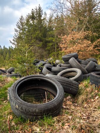 ZVANOVICE, CZECH REPUBLIC â APRIL 4: Illegal tire dump at the edge of the forestの写真素材