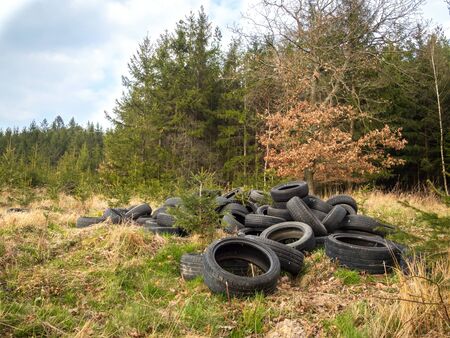ZVANOVICE, CZECH REPUBLIC â APRIL 4: Illegal tire dump at the edge of the forestの写真素材