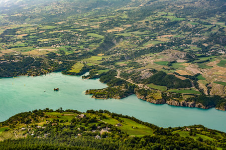 France. Hautes-Alpes (05). Serre-Poncon lake. Bay Saint-Michel and the chapel Saint-Michel. Aerial viewの写真素材