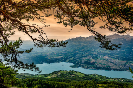 France. Hautes-Alpes (05). Serre-Poncon lake. Bay Saint-Michel and the chapel Saint-Michelの写真素材