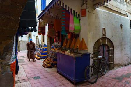 Morocco. Essaouira. A disabled man wearing djellaba walking in a street of the medinaのeditorial素材