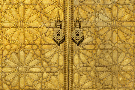 Morocco. Fez. The royal palace founded by the Merinids in 1320. It opens onto the Place des Alaouites through huge doors chiseled in copper made by a local craftsman around 1970.のeditorial素材